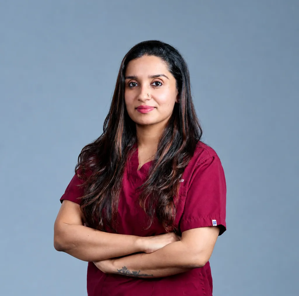 Dr. Lakshmy Sreekandan Nair in medical scrubs
