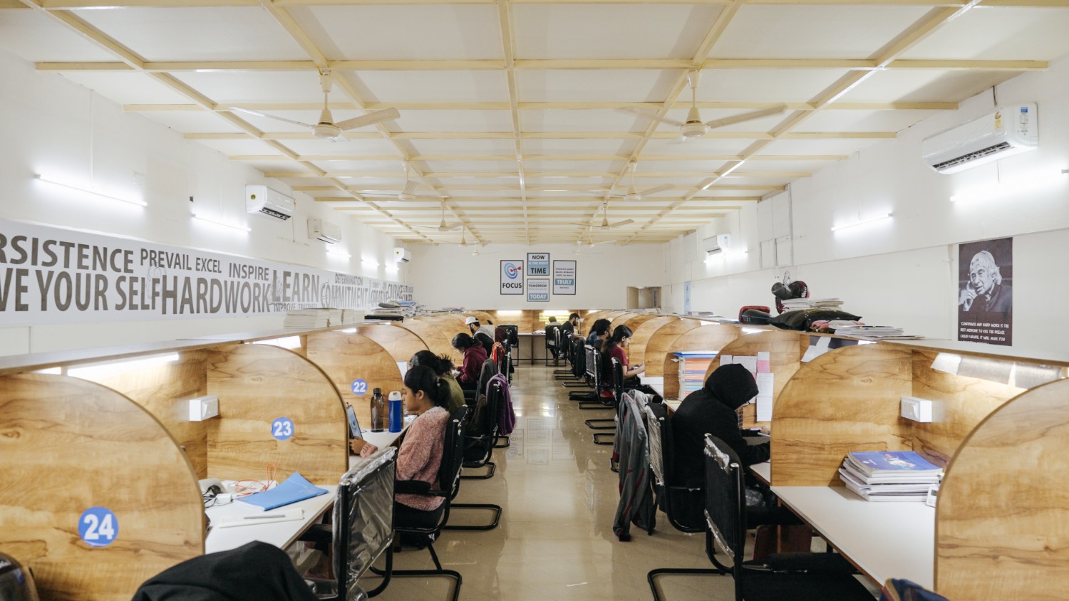 Air-conditioned reading room with students focused on their studies